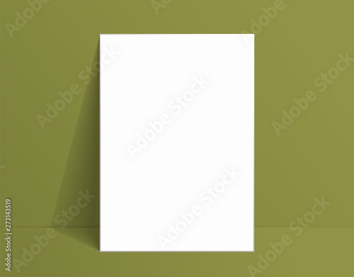 White poster mockup standing on the floor near green wall. Blank Canvas Mockup for design
