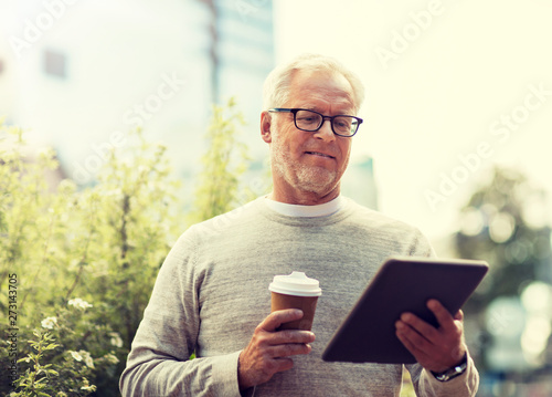 technology, people and lifestyle concept - senior man with tablet pc computer and coffee on city street