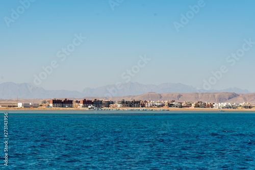 Unfinished houses by the sea. Unfinished buildings of new hotel resort in Egypt. Horizontal color photography