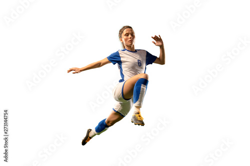 Isolated Female Soccer player on white background. Girl playing soccer © Alex
