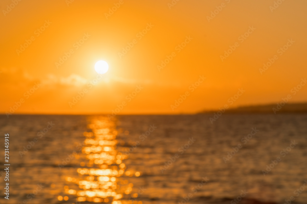 Colorful dawn over the sea, Sunset. Beautiful magic sunset over the sea. Beautiful sunset over the ocean. Sunset over water surface. blurry