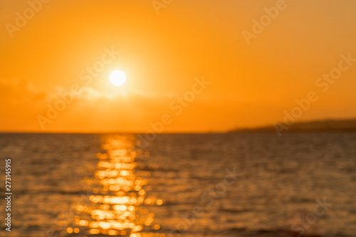 Colorful dawn over the sea, Sunset. Beautiful magic sunset over the sea. Beautiful sunset over the ocean. Sunset over water surface. blurry