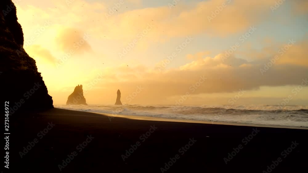 Waves crashing into the rock At Black beach in Iceland Waves crashing into the rock At Black beach in Iceland