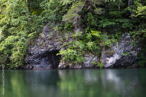 Mountain cave on the river