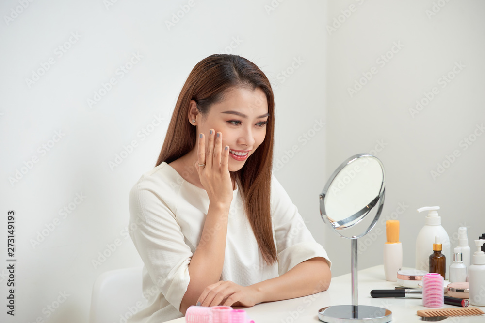 face of young beautiful healthy woman looking in the mirror face of young beautiful healthy woman looking in the mirror