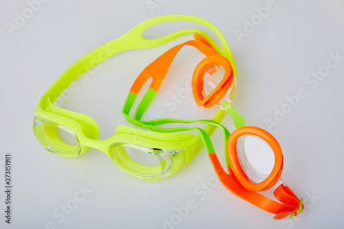 Professional glasses for swimming isolated on a white background. Kid's and adult pool goggles.