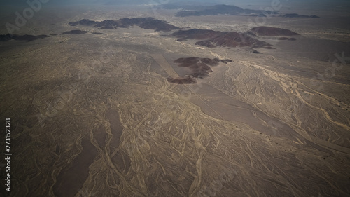 Aerial airplane panoramic view to Nazca plateau with geoglyph lines   Ica  Peru