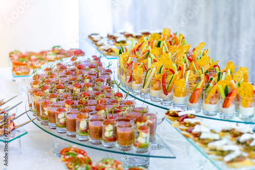 A variety of snacks, canapes and sandwiches on the table. photo