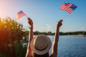 Woman holding USA flag. Celebrating Independence Day of America