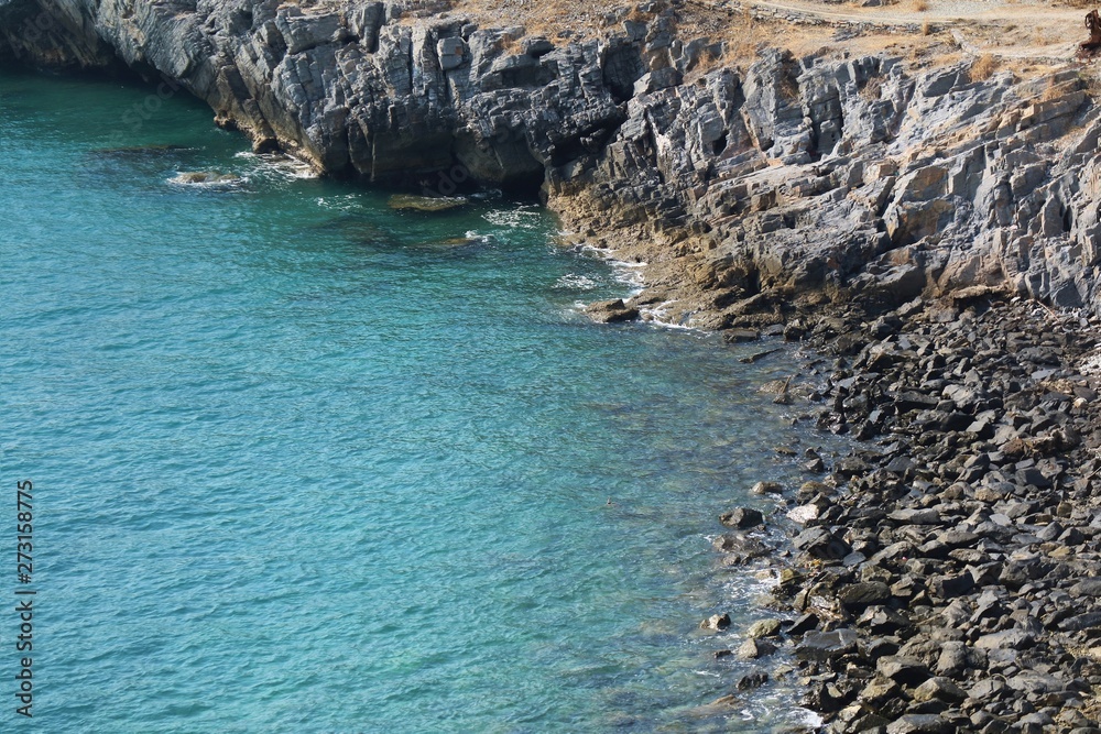 Soft focus of beautiful aerial view of rocky shore with blue sea and cliff in summer time. Nature and outdoor concept.