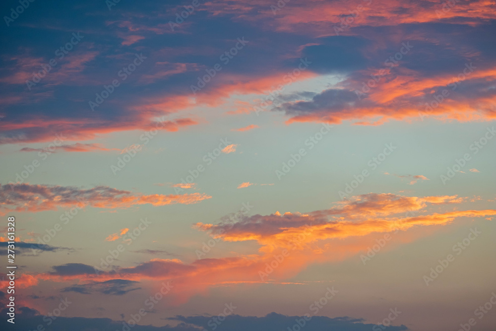 Obraz premium Clouds at sunset before rain blue orange and dark sky