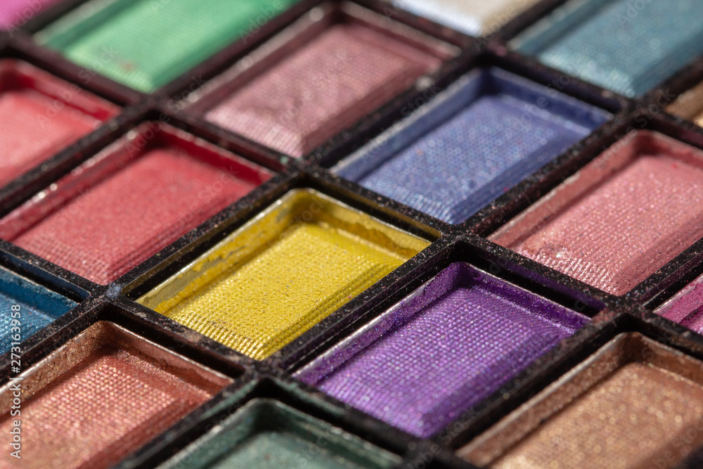 Colorful eye shadows palette. Makeup background. close up Colorful eye shadows palette. Makeup background. close up