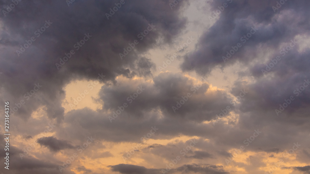 Dark stormy clouds during the sunset, dark evening sky_