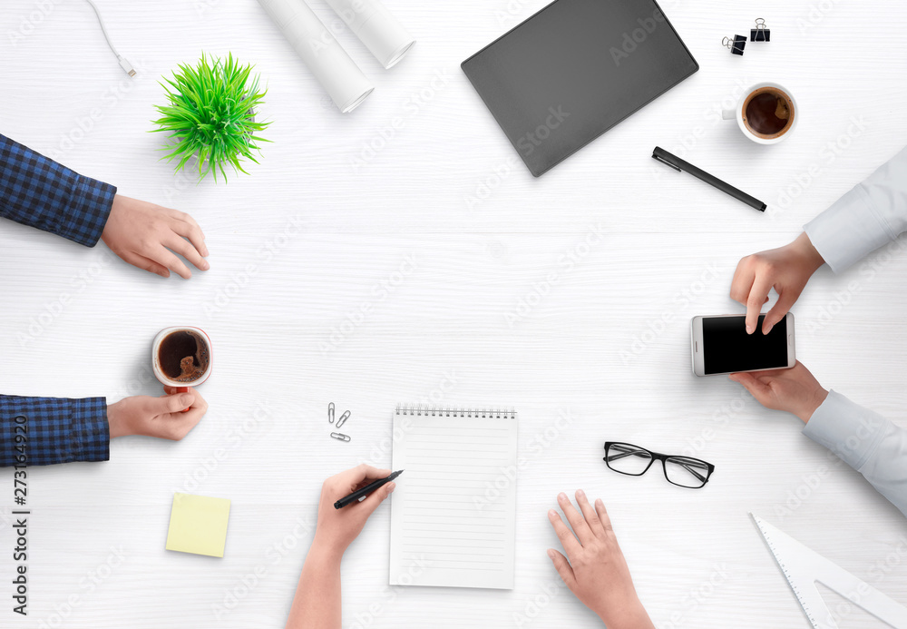 People are working on a new project. Team meeting at a work desk.Top view scene concept. People are working on a new project. Team meeting at a work desk.Top view scene concept.