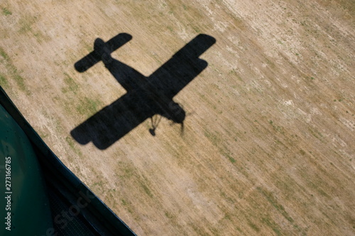 The plane takes off. The view from the open door of this aircraft to the shadow of this aircraft.