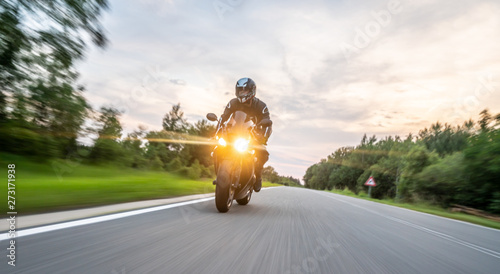 motorbike on the road riding. having fun riding the empty road on a motorcycle tour / journey