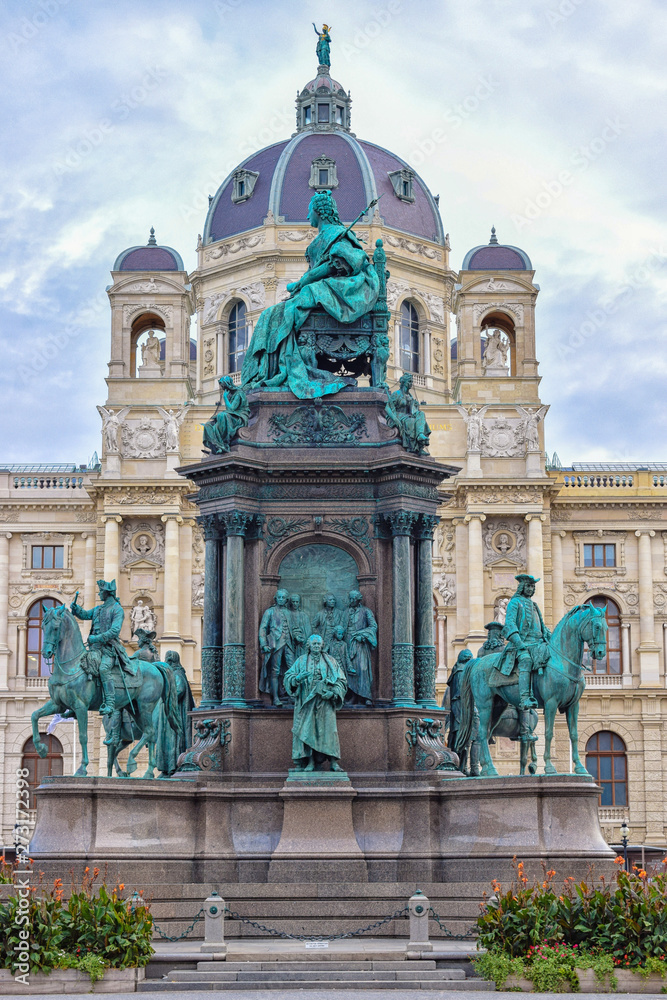 Sculptures of queen and horses with dome museum background in Vienna Austria with blue sky