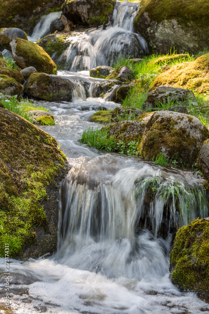 Small Waterfall in summer park