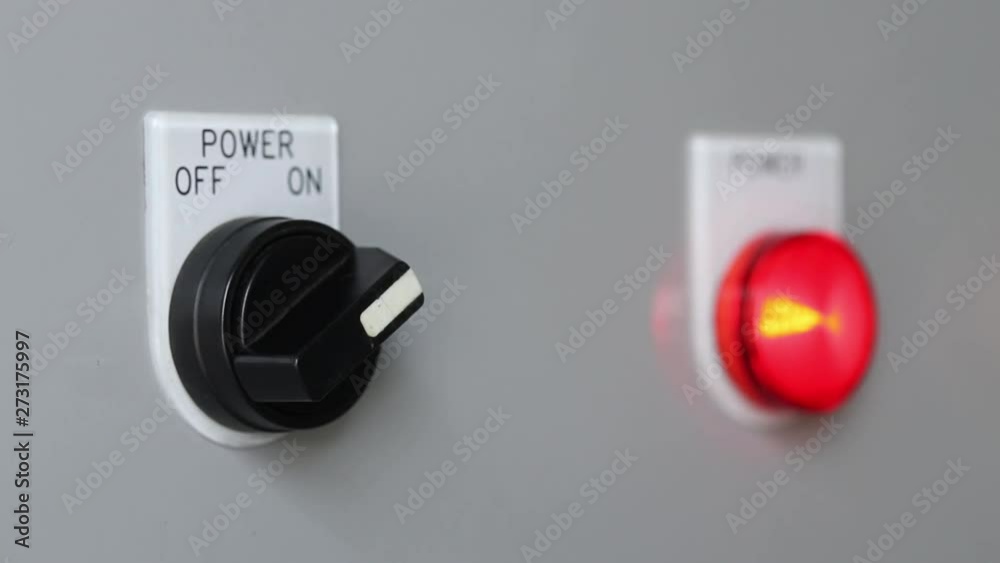 Close-up of hand turn on machine power switch