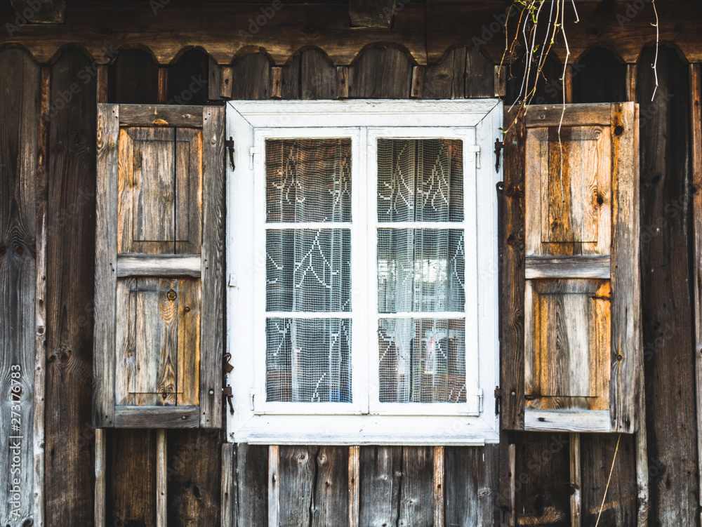 Old wooden windows in a rural hut Old wooden windows in a rural hut