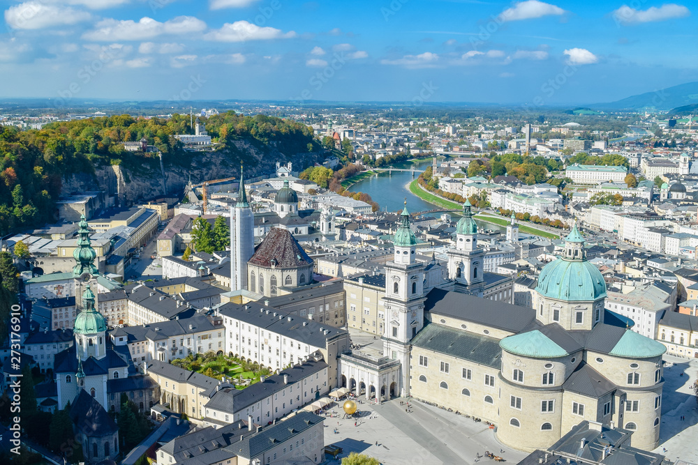 Aerial view of old city with river and blue roofs in autumn in Salzburg Austria with cloudy sky