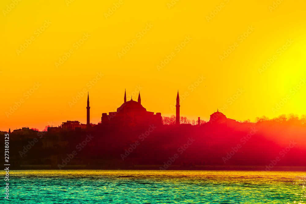 Istanbul city view silhouettes. Sunset in Bosphorus. Muslim mosque landscape.