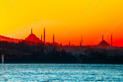 Istanbul city view silhouettes. Sunset in Bosphorus. Muslim mosque landscape.
