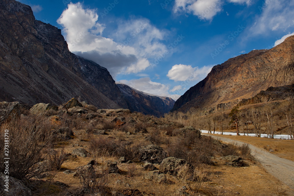 Russia. Mountain Altai. Dirt road in the valley of the river Chulyshman. Russia. Mountain Altai. Dirt road in the valley of the river Chulyshman.