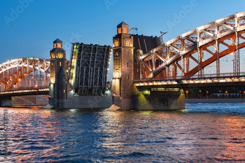 Bolsheokhtinsky bridge in St. Petersburg at night with open spans over the Neva. photo