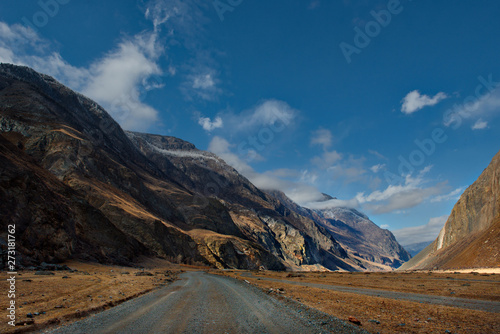 Russia. Mountain Altai. Dirt road in the valley of the river Chulyshman.