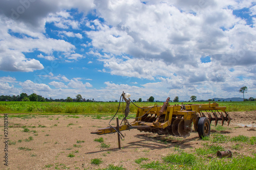 Agricultural tractors for deep plowing Plowing on trailers for tractors, plowing to plow unused land, being stored at the farm in the morning