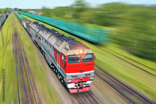 Freight train going in a hurry along the train at high speed. Railway Transport Concept.