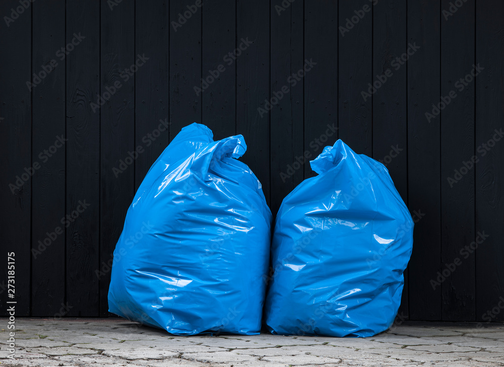 plastic blue trash bag in the street Stock Photo Adobe Stock