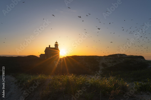 Silhouette of North Lighthouse at sunset on Block Island 