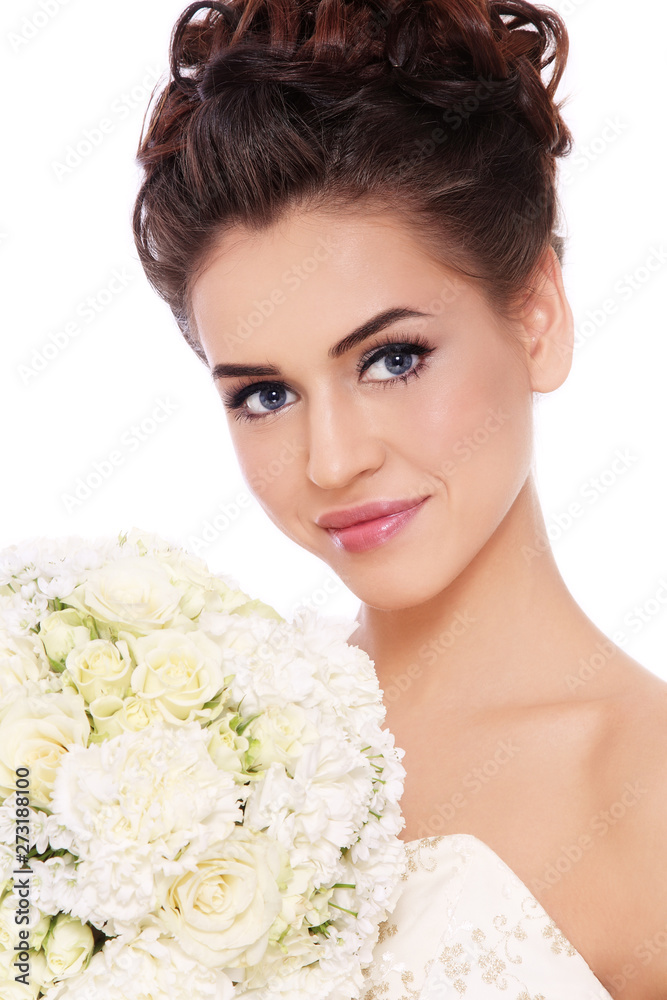 Naklejka premium Young beautiful slim bride with prom makeup and fancy bouckuet