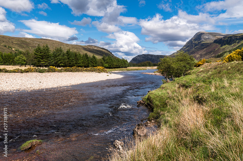 The Strathmore River flowing north along Strath More under the slopes of Ben More into Loch Hope, Sutherland, Scotland.