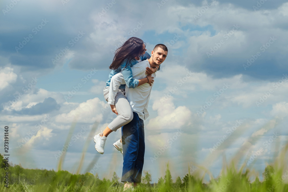 Young Couple having fun outdoors at sunny summer day. Young Couple having fun outdoors at sunny summer day.