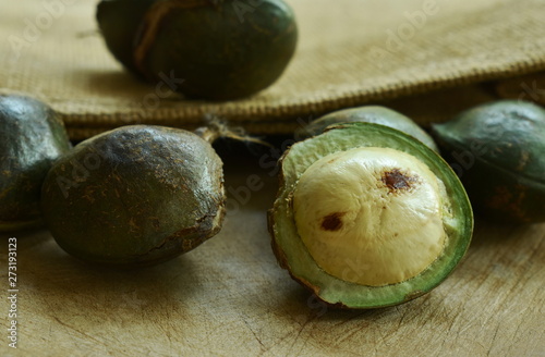 Djenkol bean or luk nieng fruit tropical plant on wooden board photo