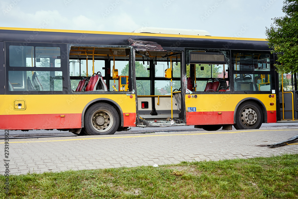 View of devastated city bus after road accident.