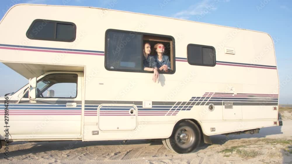 two young women in the autotrailer window two young women in the autotrailer window