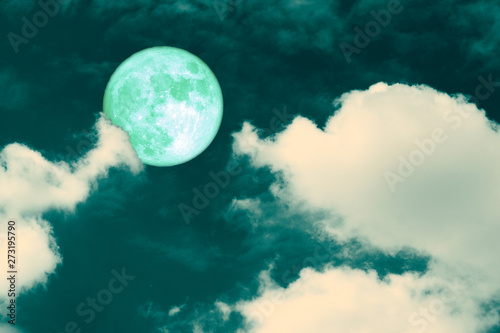 green strawberry moon back on silhouette heap cloud on night sky