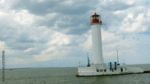 Wallpaper Mural Alone lighthouse located in the sea, against the background  in the gulf of Odessa, next to odessa harbour in Black Sea. Vorontsov lighthouse. Blue sky. Selective soft focus.  Torontodigital.ca