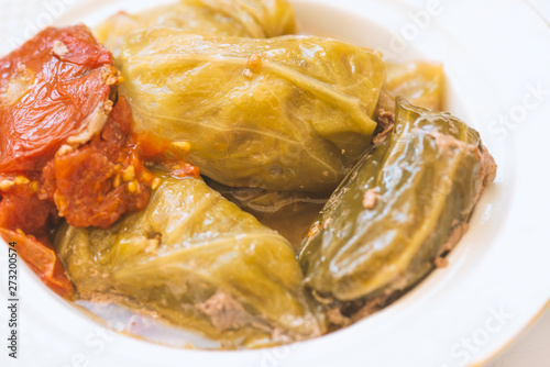 Cabbage leaves stuffed with meat. Rolls of cabbage. Chou farci, charuto, dolma, sarma, golubtsy, holubtsi or golabki. photo