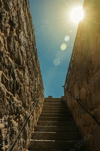 Φωτογραφία Sunbeam above staircase going up a thick wall in Avila