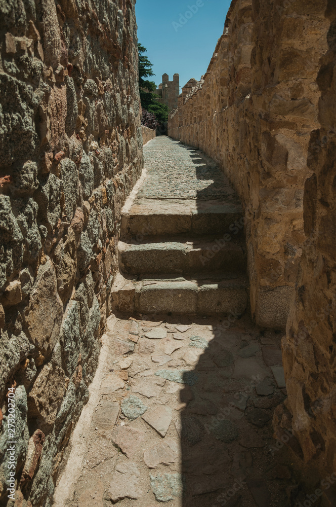 Pathway with stairs over wall with battlement around Avila