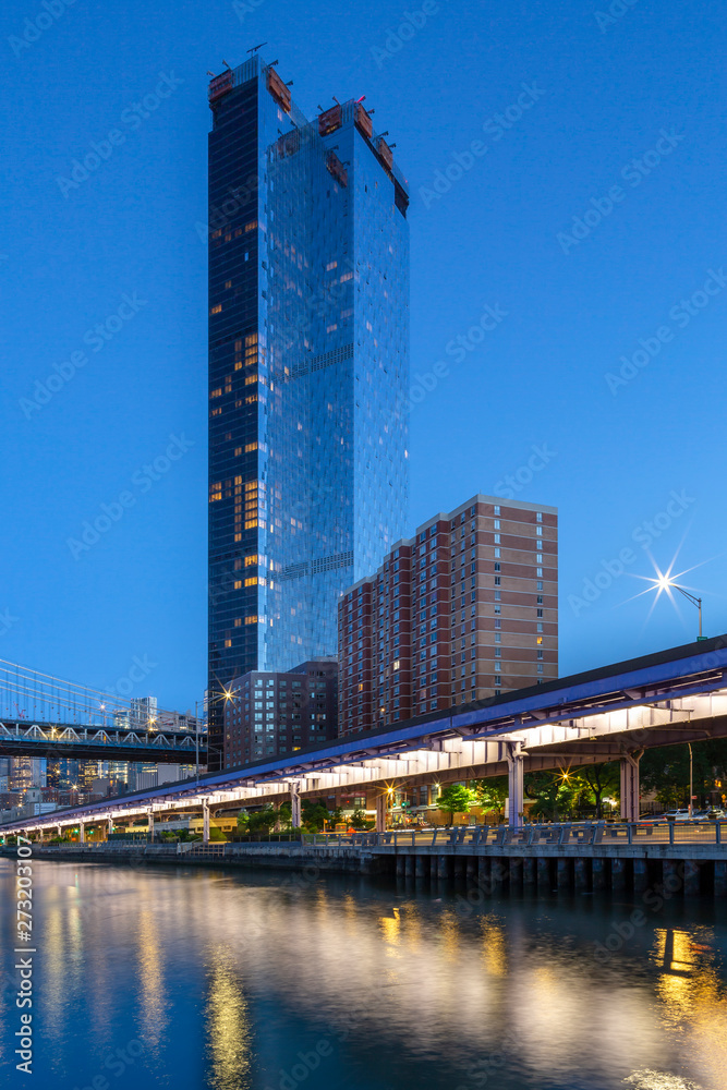 View on One Manhattan Square building  from east river at blue hour with long exposure