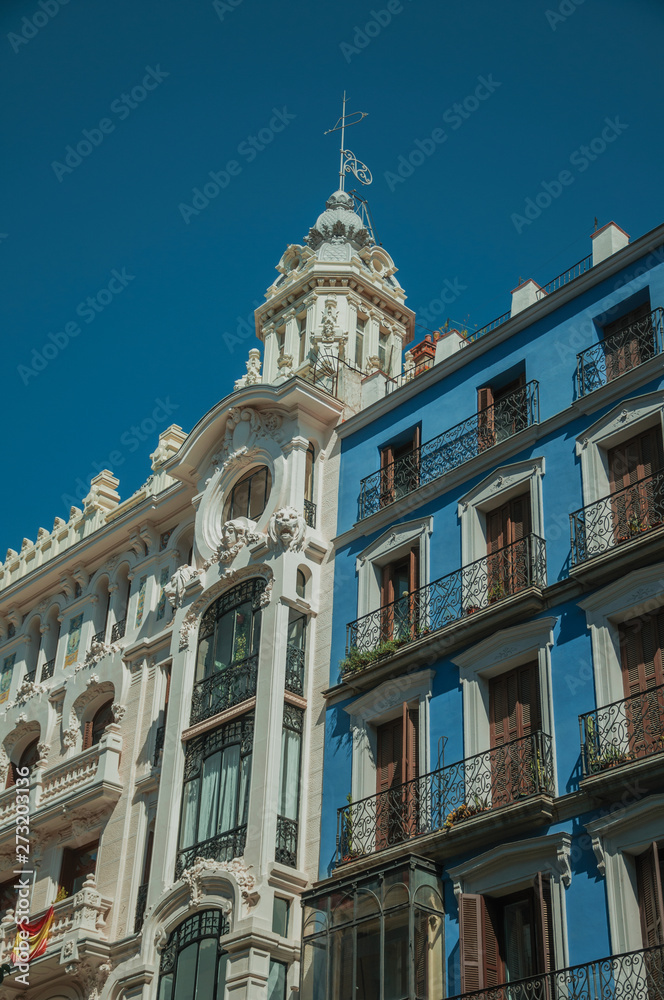 Colorful buildings full of windows and balconies in Madrid