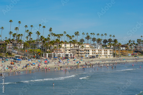 Obraz na płótnie People on the beach enjoying beautiful spring day at Oceanside beach in San Diego, California