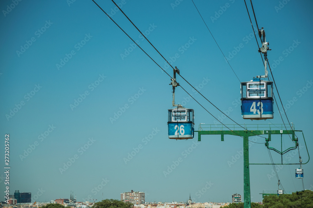 Cable car gondola and big supporting towers at the Teleferico Park of Madrid