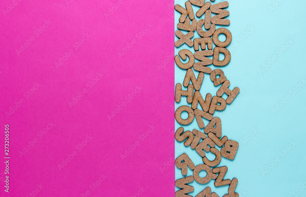 Many letters on a colored background. Minimalism. Copy space